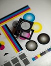 Color management Ã¢â¬â Printing magnifying glass standing on test color paper Royalty Free Stock Photo